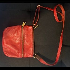Fossil, distressed red leather cross body bag.